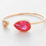 Open gold ring ruby