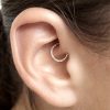 Thin daith hoop earring in sterling silver with diamond cut finish