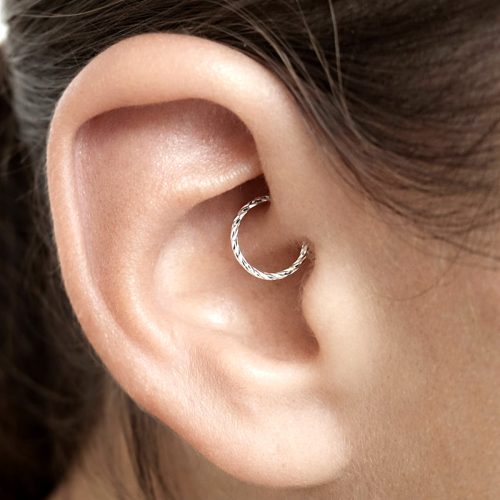 Thin daith hoop earring in sterling silver with diamond cut finish
