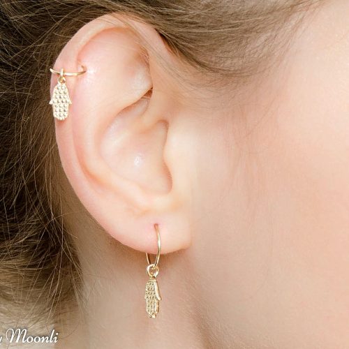 Tiny hamsa charm on a helix hoop earring in 14k gold filled