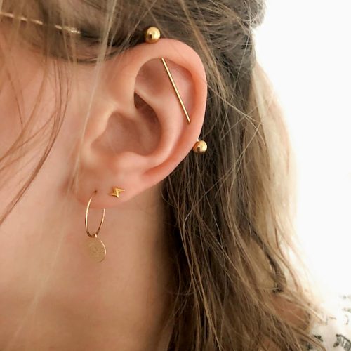 Industrial barbell piercing in gold color stainless steel