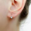 Opal teardrop stud earrings in {material} with a {opal color} opal bead, photo 2