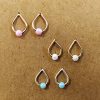 Opal teardrop stud earrings in {material} with a {opal color} opal bead, photo 6