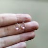 Opal teardrop stud earrings in {material} with a {opal color} opal bead, photo 9