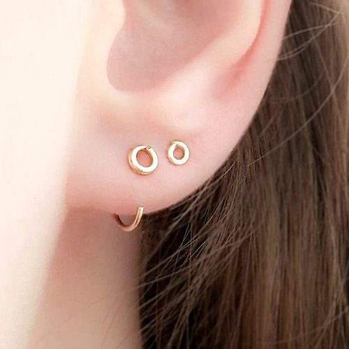 Tiny hugging hoop earrings with a double wrapped circle stud in 14k gold filled
