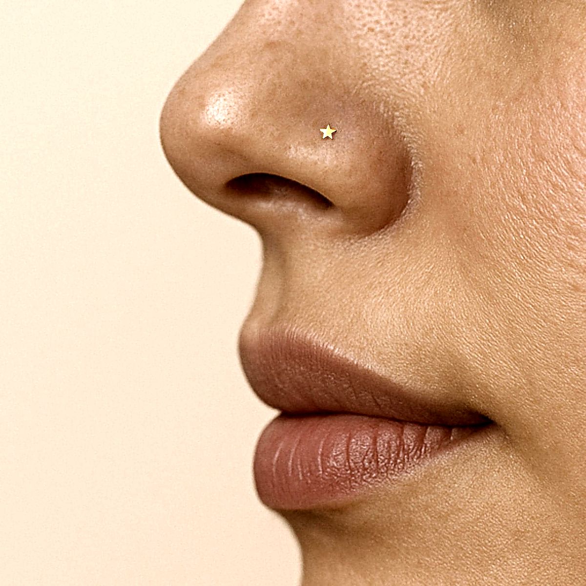 Tiny 2 mm star nose stud in 14k gold filled, photo 2