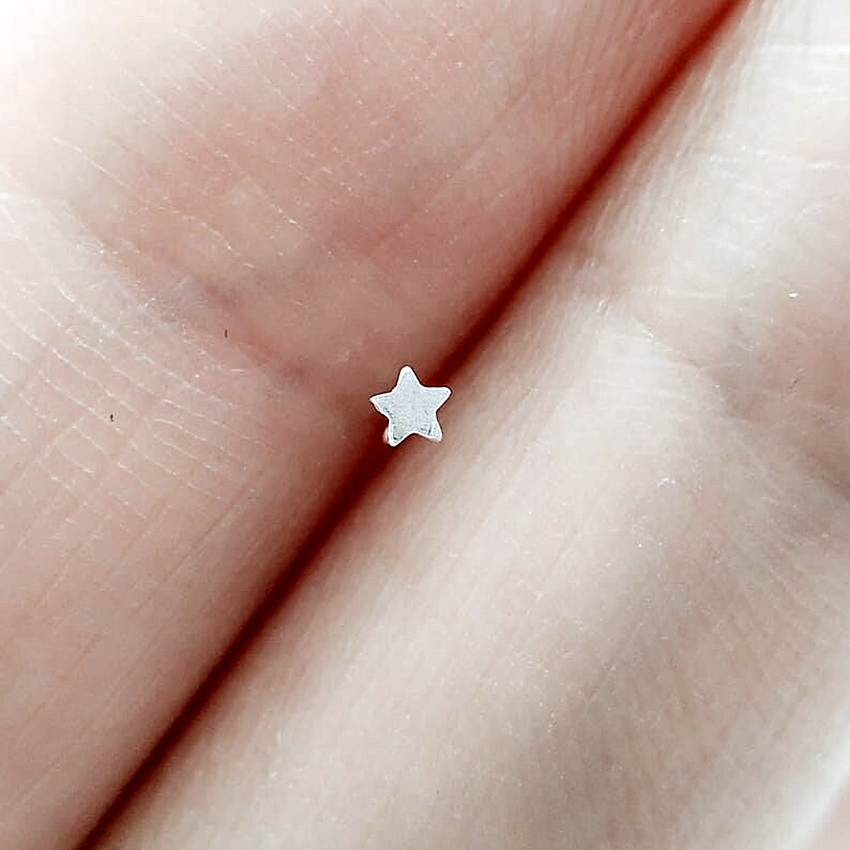 Tiny 2 mm star nose stud in 14k gold filled, photo 4